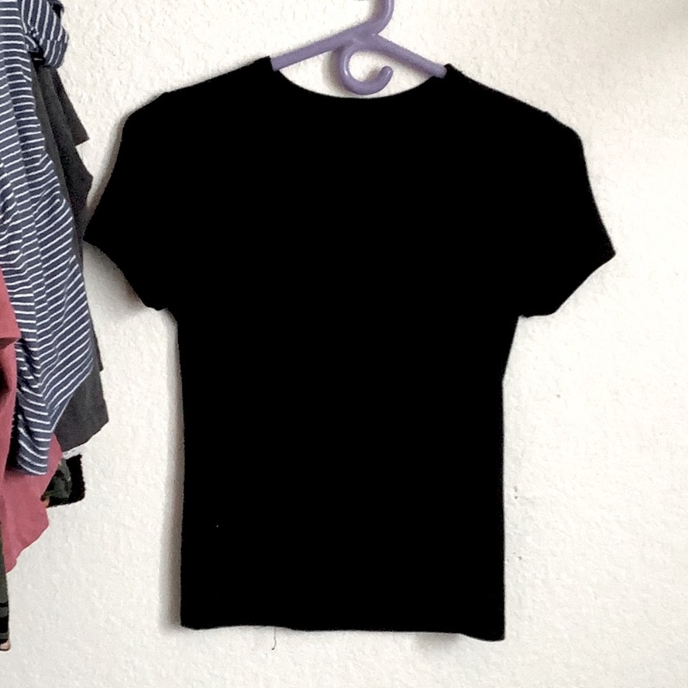 The shirt I’m selling is a women’s tight black shirt. It is still in great shape